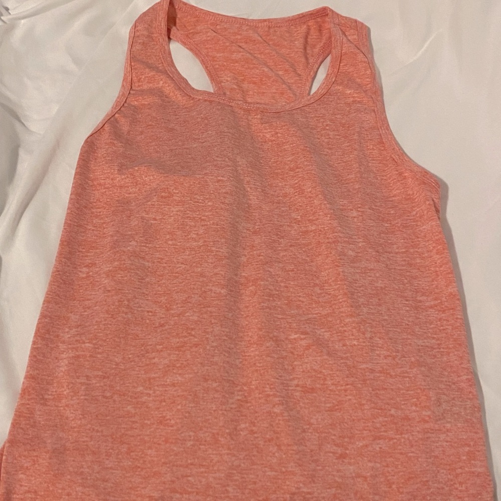 Coral tank top for working out.